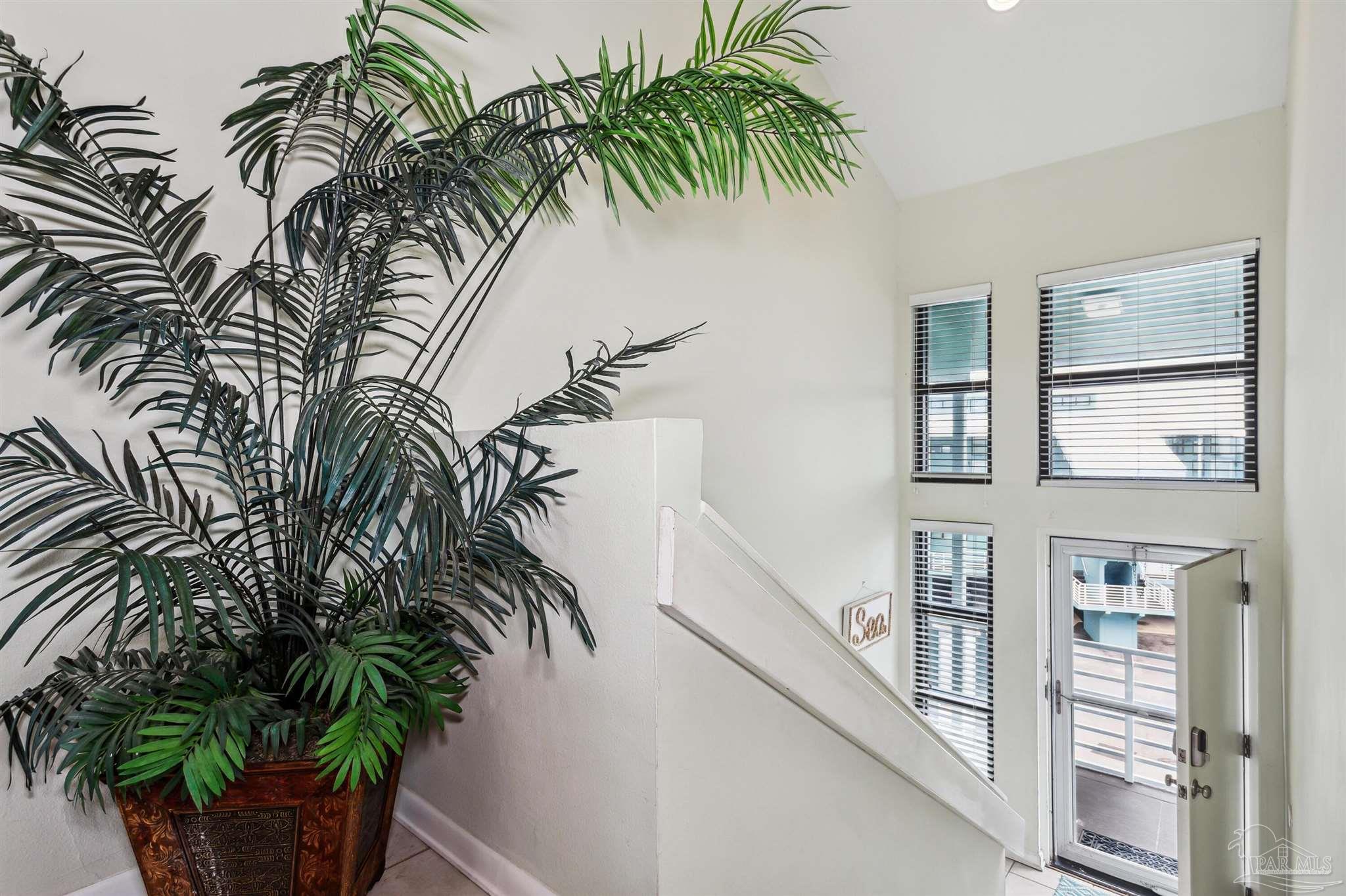 1390 Fort Pickens Road, Unit 229 Pensacola Beach, FL 32561 - Photo 4 of 47 a couple of potted plants in front of door