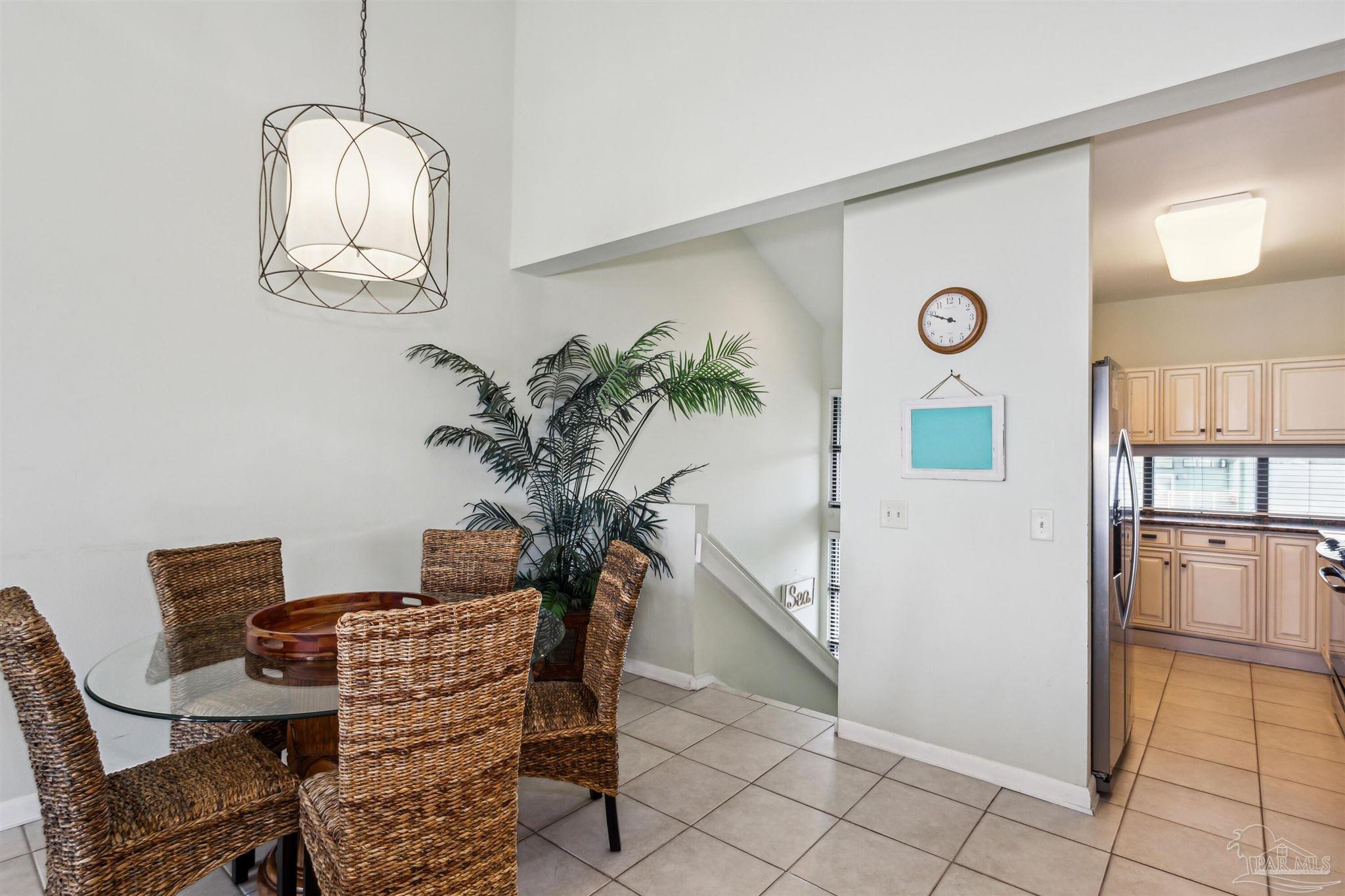 1390 Fort Pickens Road, Unit 229 Pensacola Beach, FL 32561 - Photo 5 of 47 a view of a dining room with furniture