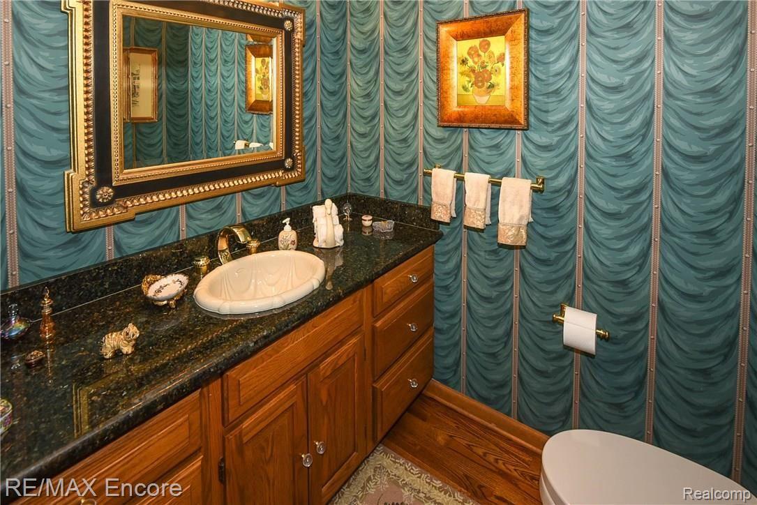 1284 Pebble Pointe Drive Rochester, MI 48307 - Photo 35 of 85 Half bath with granite counters and custom sink