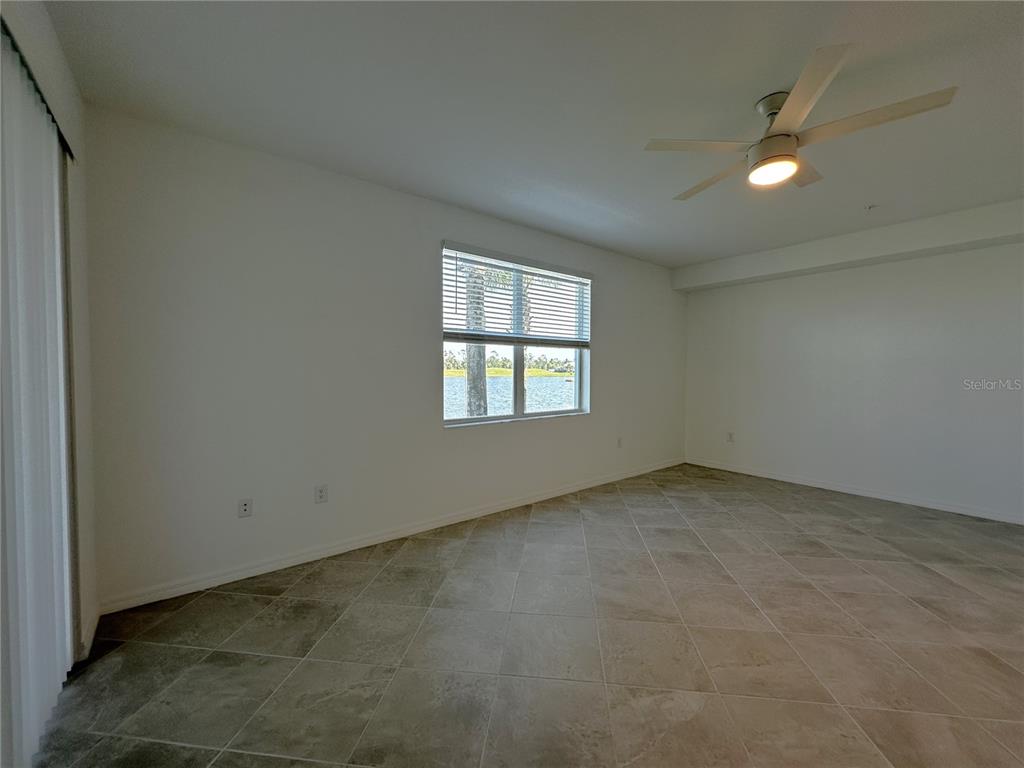 14149 Poppy Field Loop, Unit 6012 Punta Gorda, FL 33950 - Photo 9 of 49 an empty room with windows