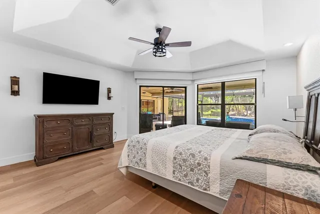 a spacious bathroom with a bathtub sink and mirror
