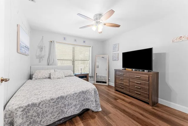 a bedroom with a bed and a table in it