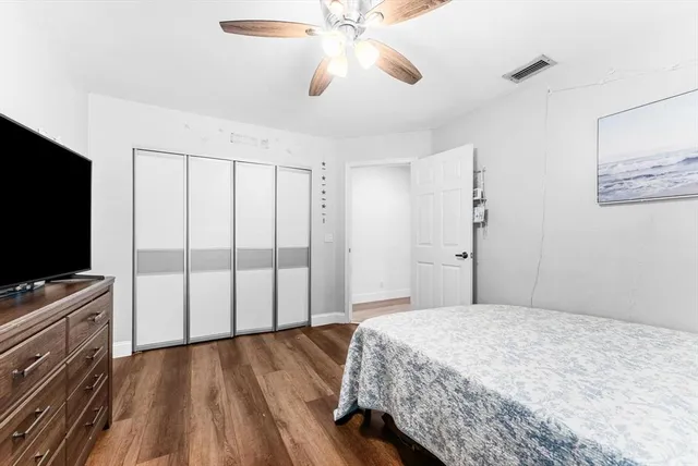 a bathroom with a sink a toilet a shower and a mirror