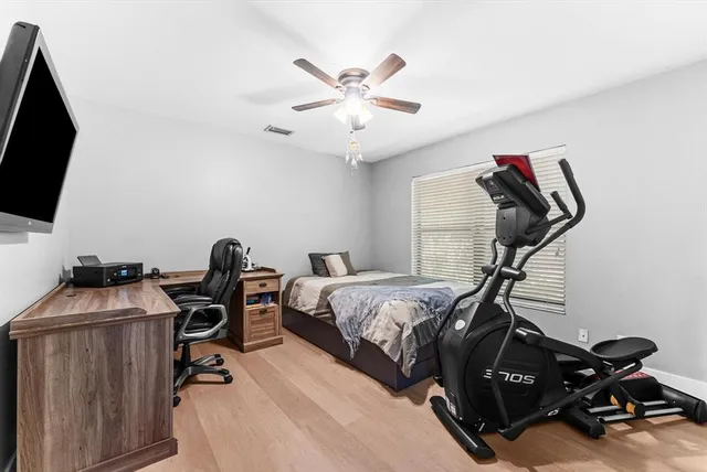 a view of a livingroom with a dining table and chairs