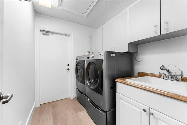 a living room with furniture and large windows