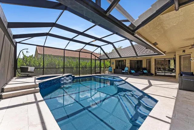 a view of a backyard with a table and chairs