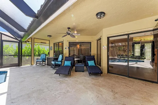 a view of a house with a backyard and a tree