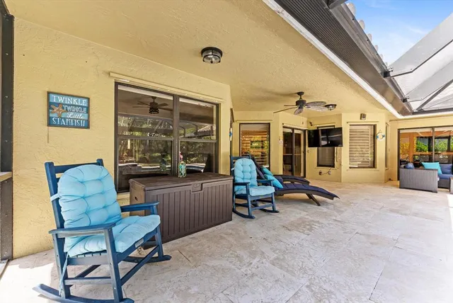 a view of yard with swimming pool and sitting area