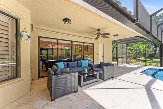 an aerial view of a house with yard and outdoor seating