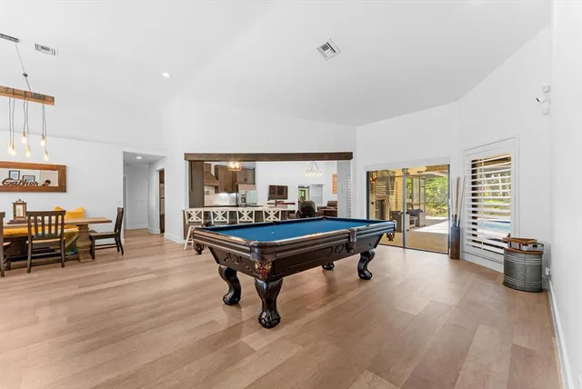 a living room with furniture a wooden floor and a window