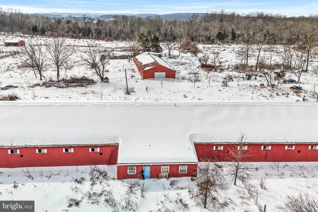 a view of a yard covered with snow