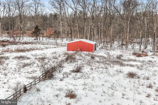 a view of a house with a door and wooden door