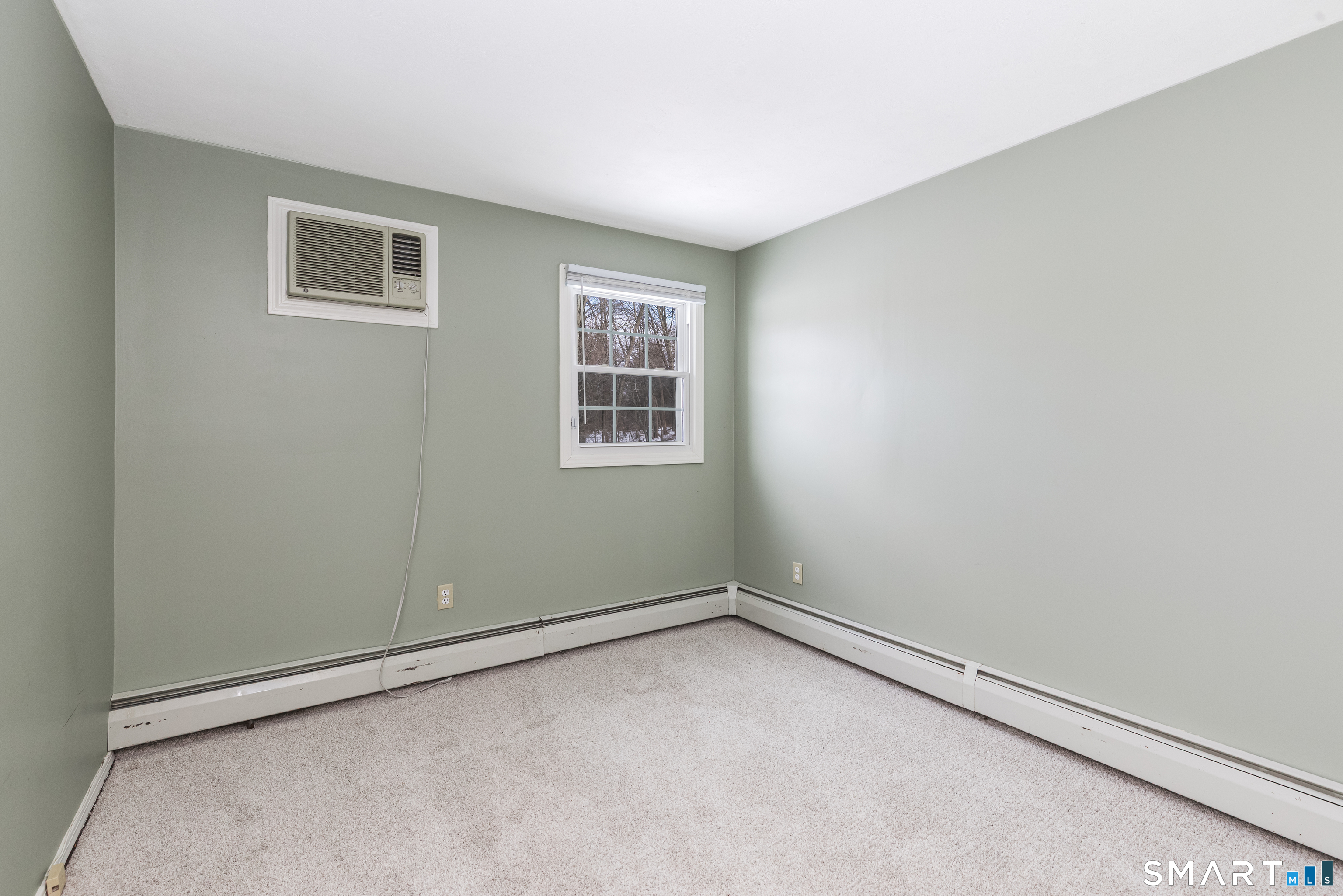 10 Apple Tree Road Bethel, CT 06801 - Photo 15 of 32 an empty room with a window