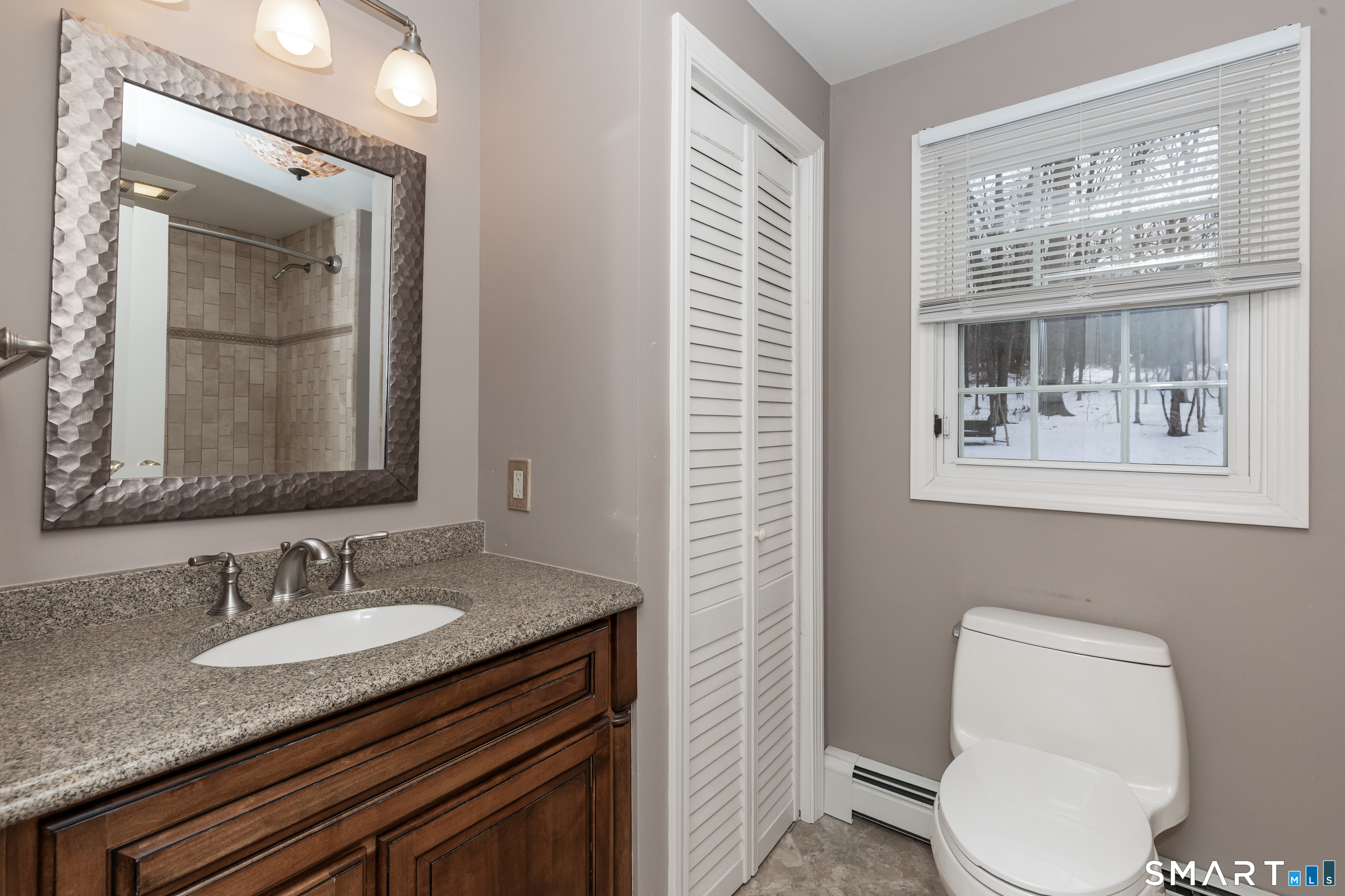 10 Apple Tree Road Bethel, CT 06801 - Photo 17 of 32 a bathroom with a granite countertop sink vanity mirror and toilet
