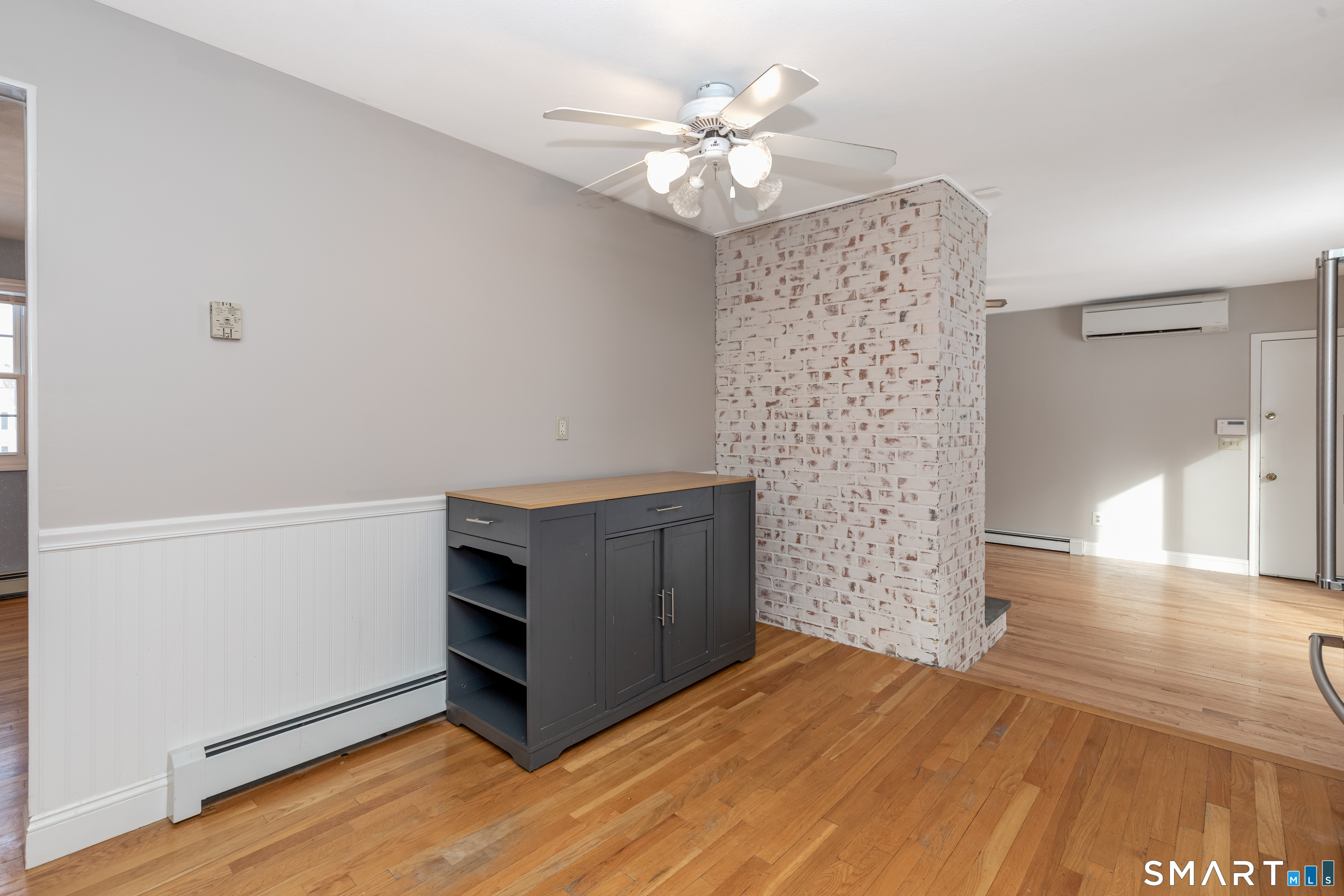 10 Apple Tree Road Bethel, CT 06801 - Photo 21 of 32 a room with a hallway and a chandelier