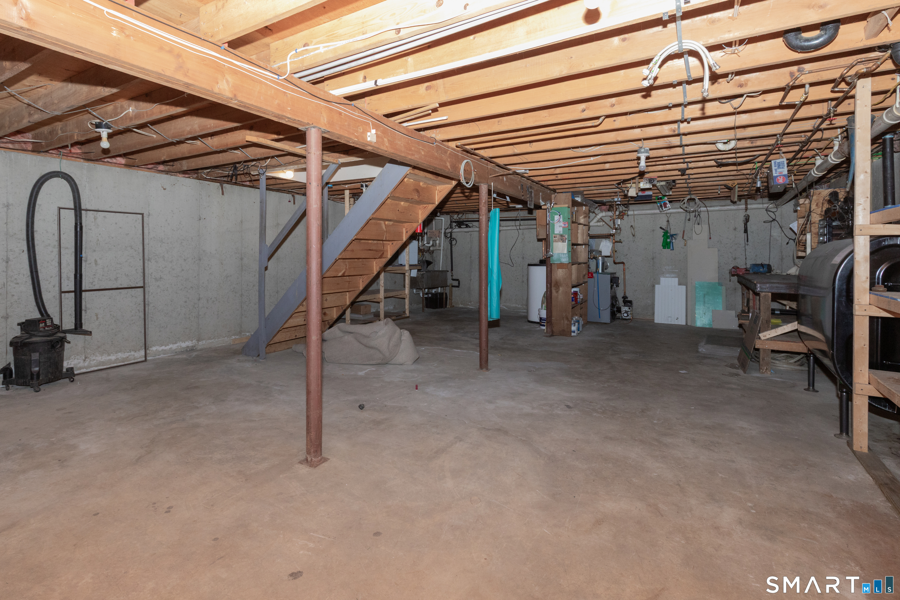 10 Apple Tree Road Bethel, CT 06801 - Photo 27 of 32 a view of a big room with wooden roof and stairs