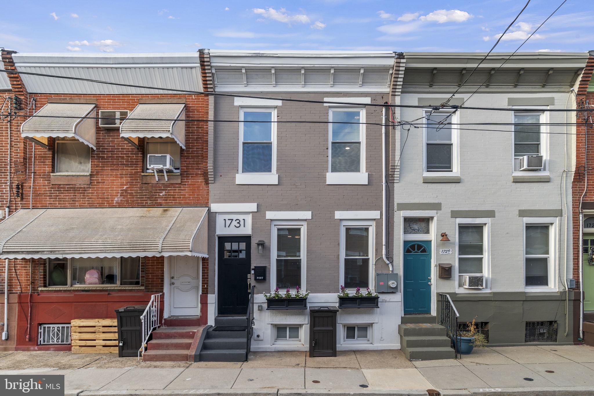 a front view of a building with glass windows