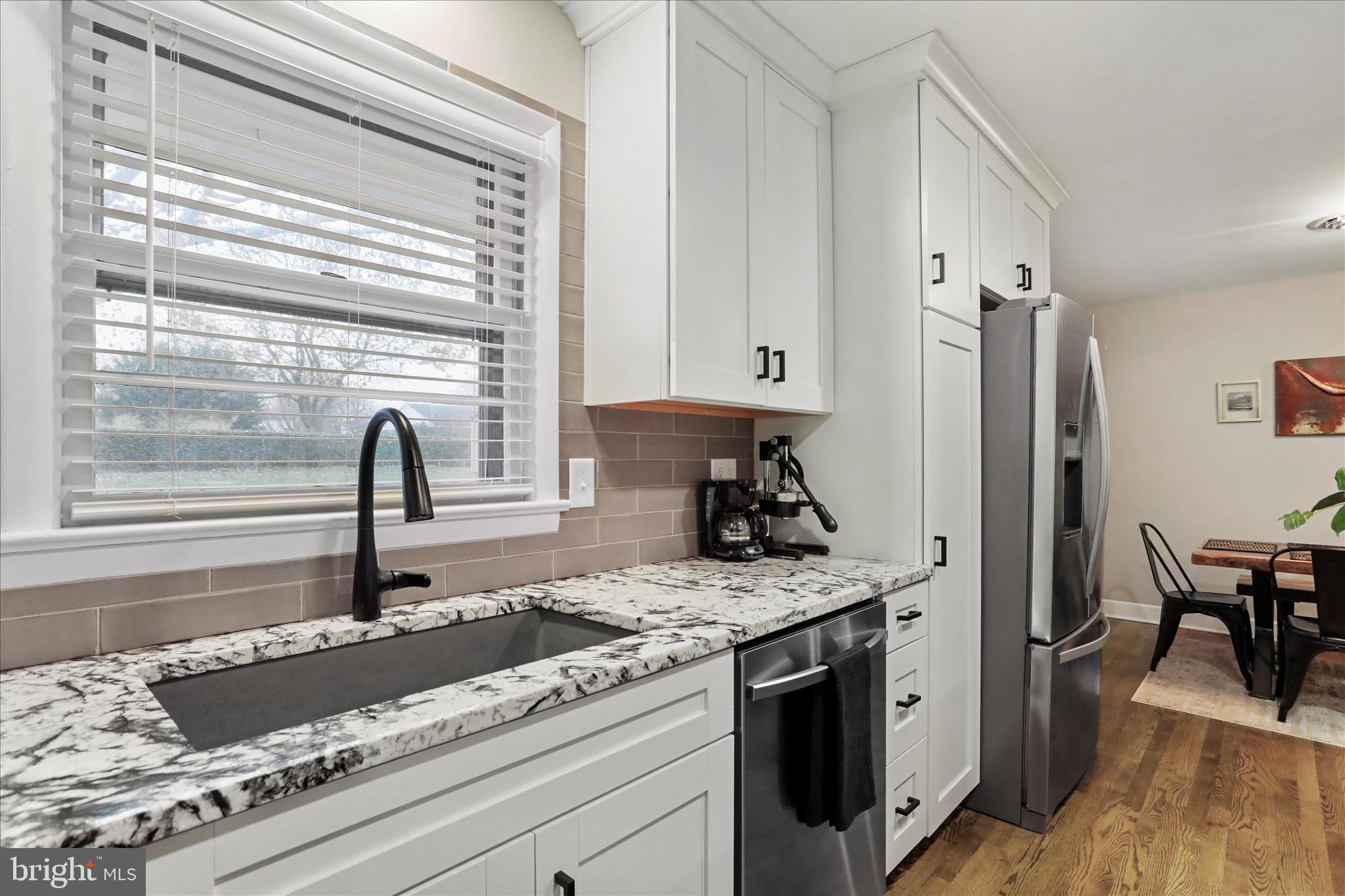 13347 Keener Road Hagerstown, MD 21742 - Photo 12 of 44 a kitchen with granite countertop a sink stainless steel appliances and cabinets