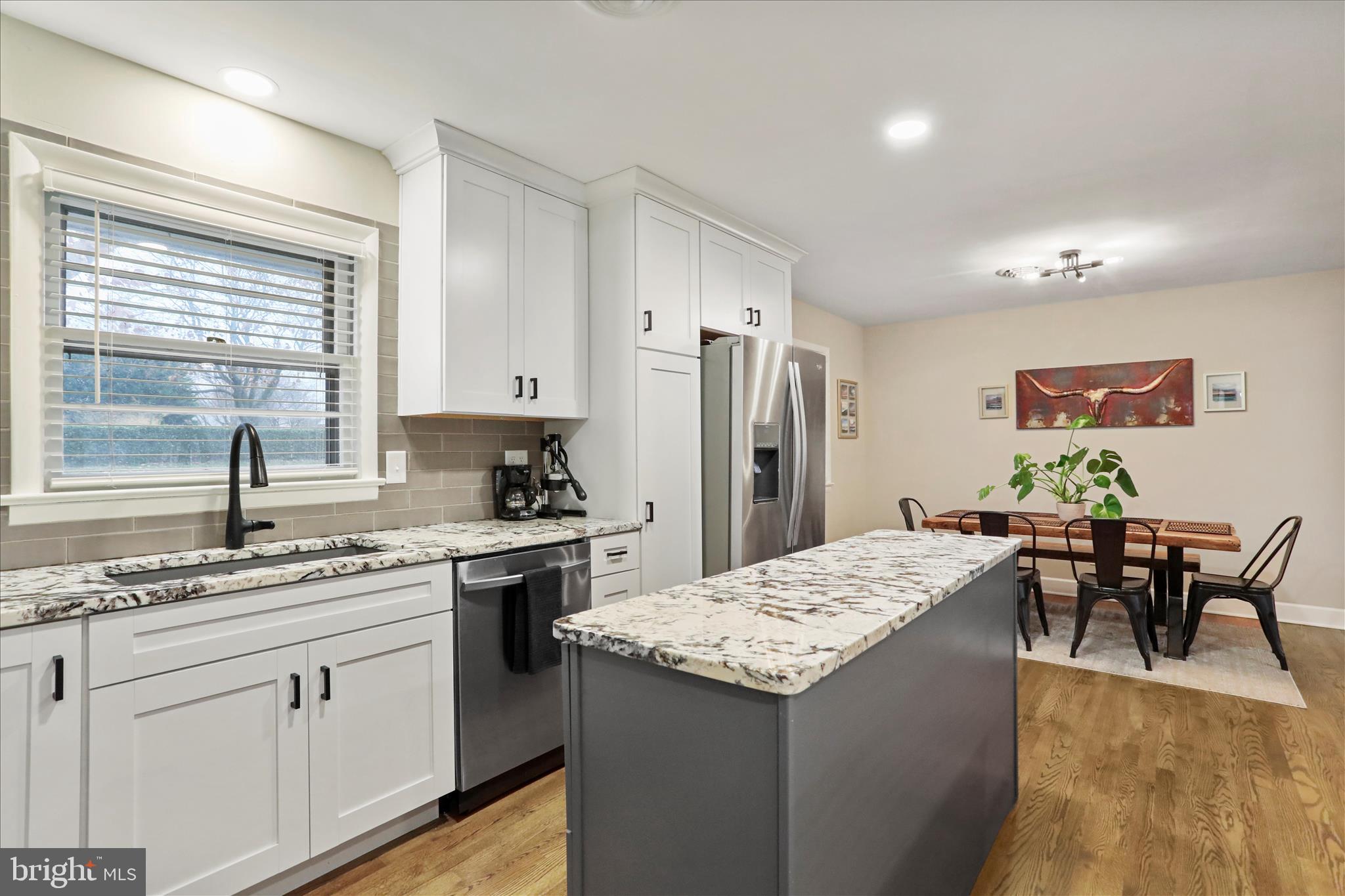 13347 Keener Road Hagerstown, MD 21742 - Photo 13 of 44 a kitchen with stainless steel appliances granite countertop refrigerator sink dining table and chairs