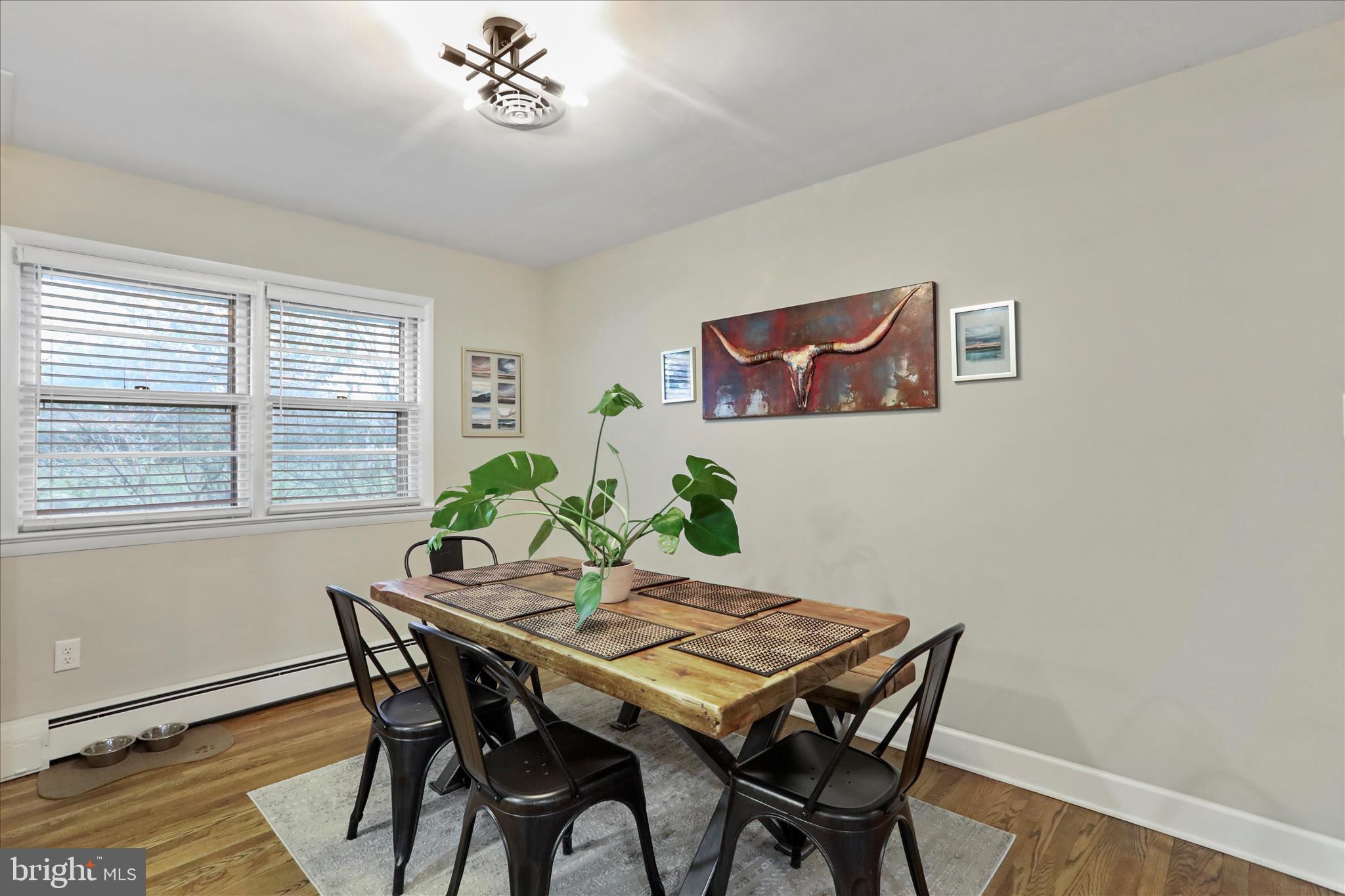13347 Keener Road Hagerstown, MD 21742 - Photo 14 of 44 a view of a dining room with furniture and a potted plant