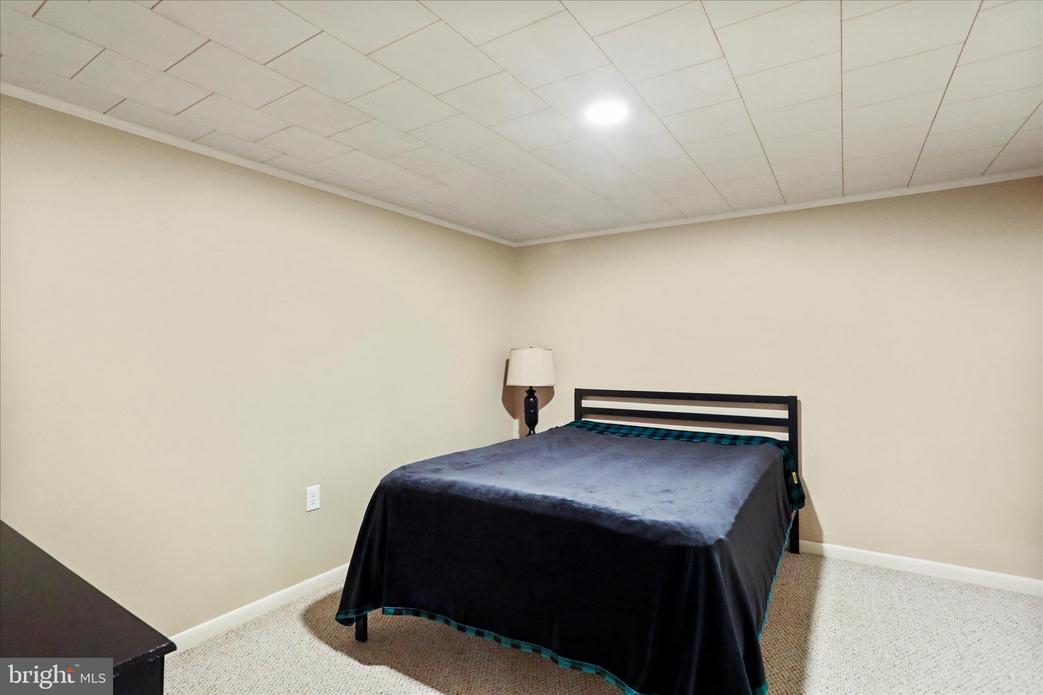 13347 Keener Road Hagerstown, MD 21742 - Photo 35 of 44 a bedroom with a bed and dresser