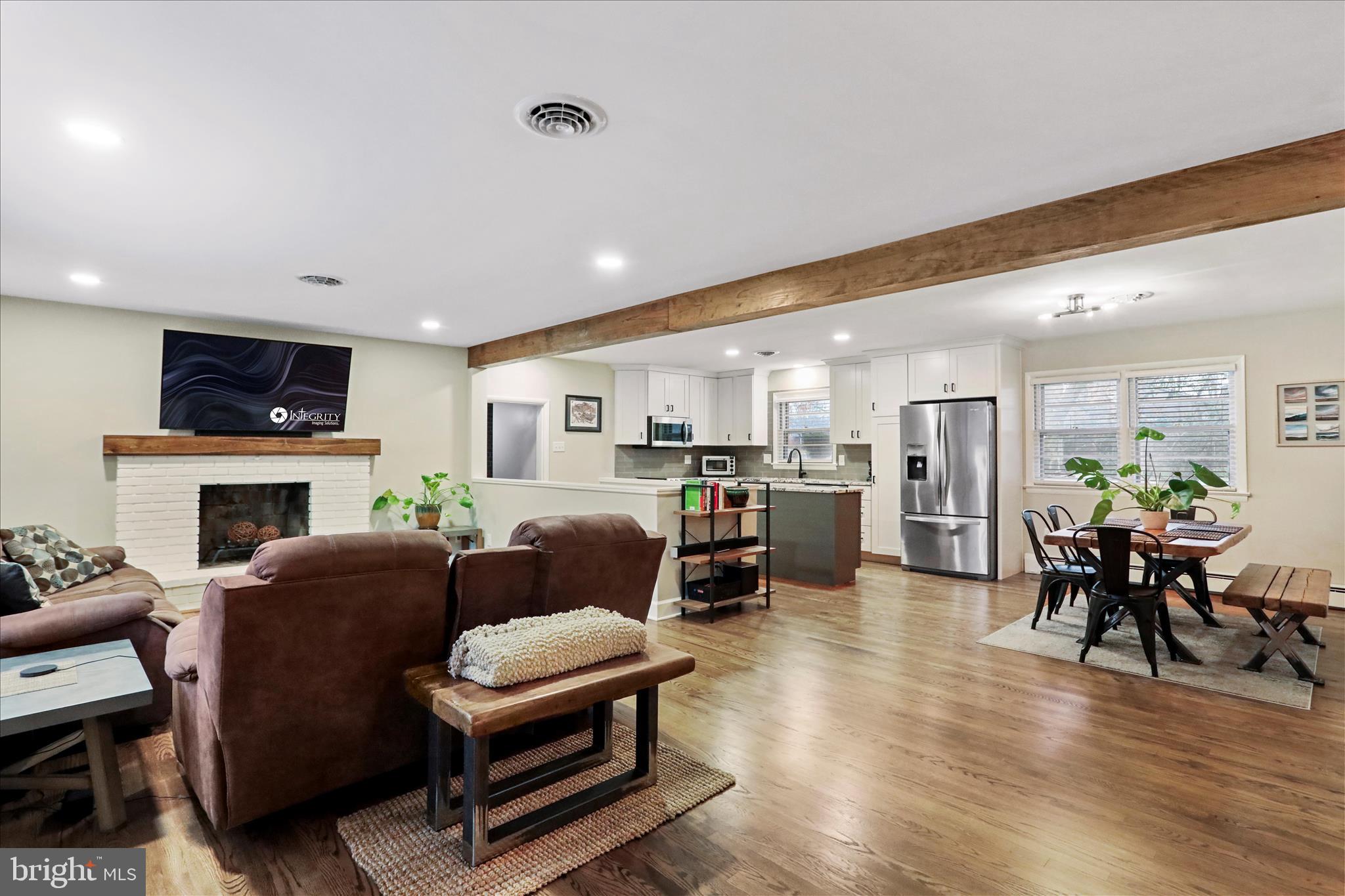 13347 Keener Road Hagerstown, MD 21742 - Photo 5 of 44 a living room with furniture kitchen view and a fireplace