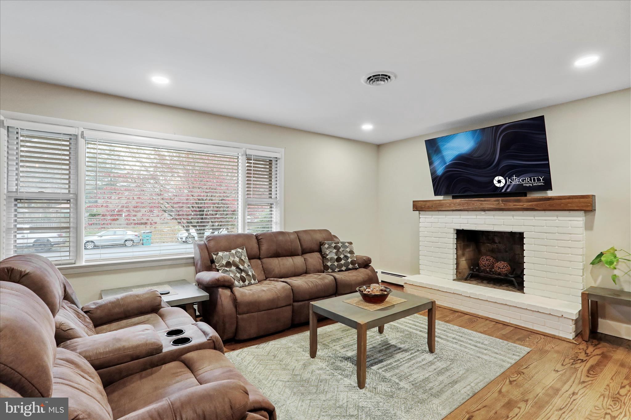 13347 Keener Road Hagerstown, MD 21742 - Photo 6 of 44 a living room with furniture a fireplace and a large window