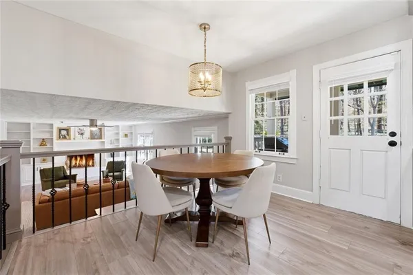 a view of a dining room with furniture window and wooden floor