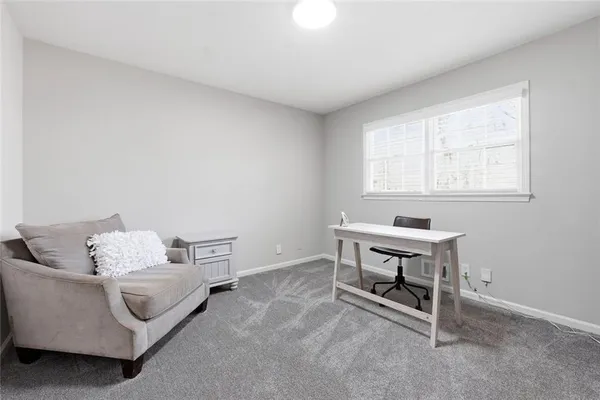 a bedroom with furniture and a window