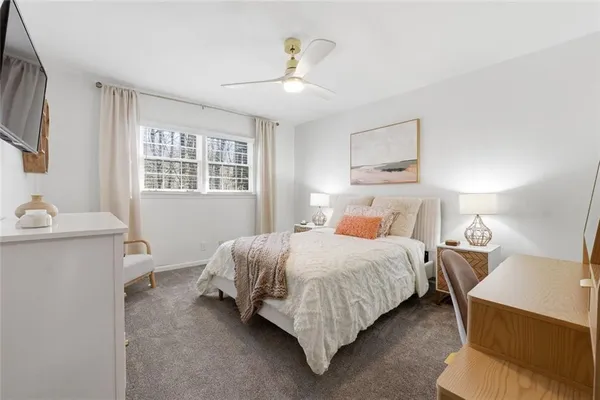 a bedroom with a bed and window