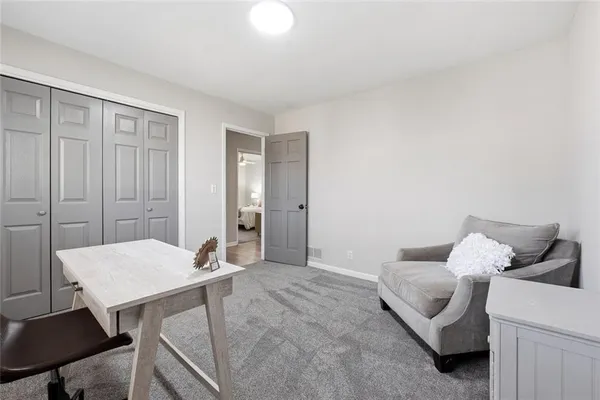 a living room with furniture and a table