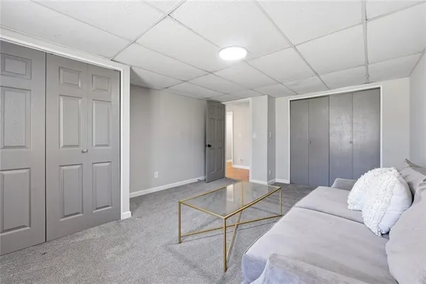 a spacious bedroom with a bed and a table