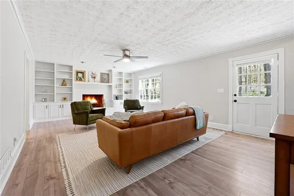 a living room with furniture and a fireplace