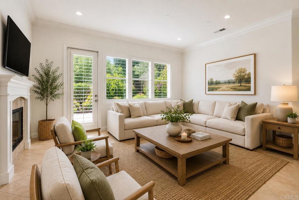 672 Inverlochy Drive Fallbrook, CA 92028 - Photo 26 of 75 a living room with furniture a flat screen tv and a large window