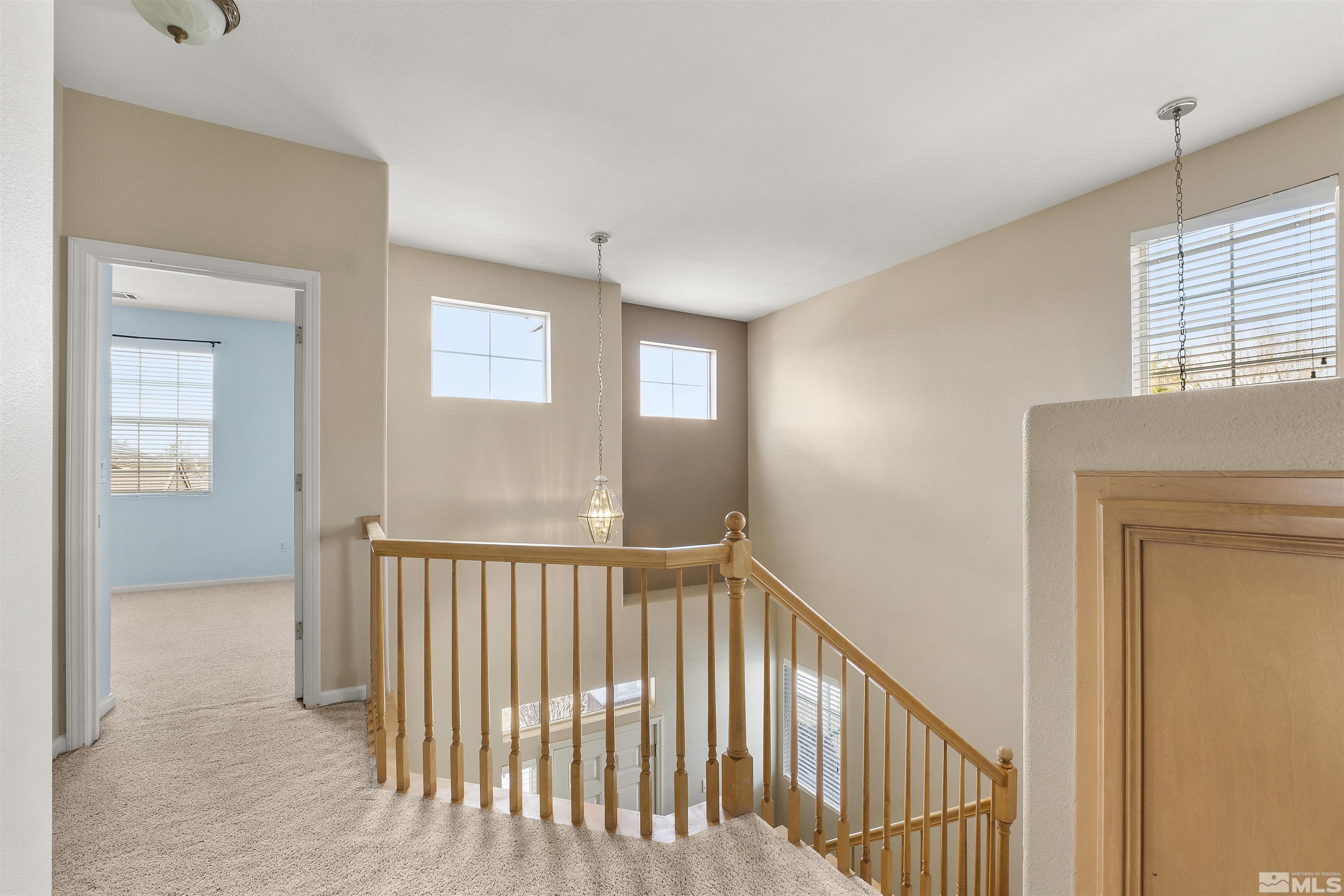 10200 Wolf Ridge Way Reno, NV 89521 - Photo 15 of 40 a view of a hallway with windows