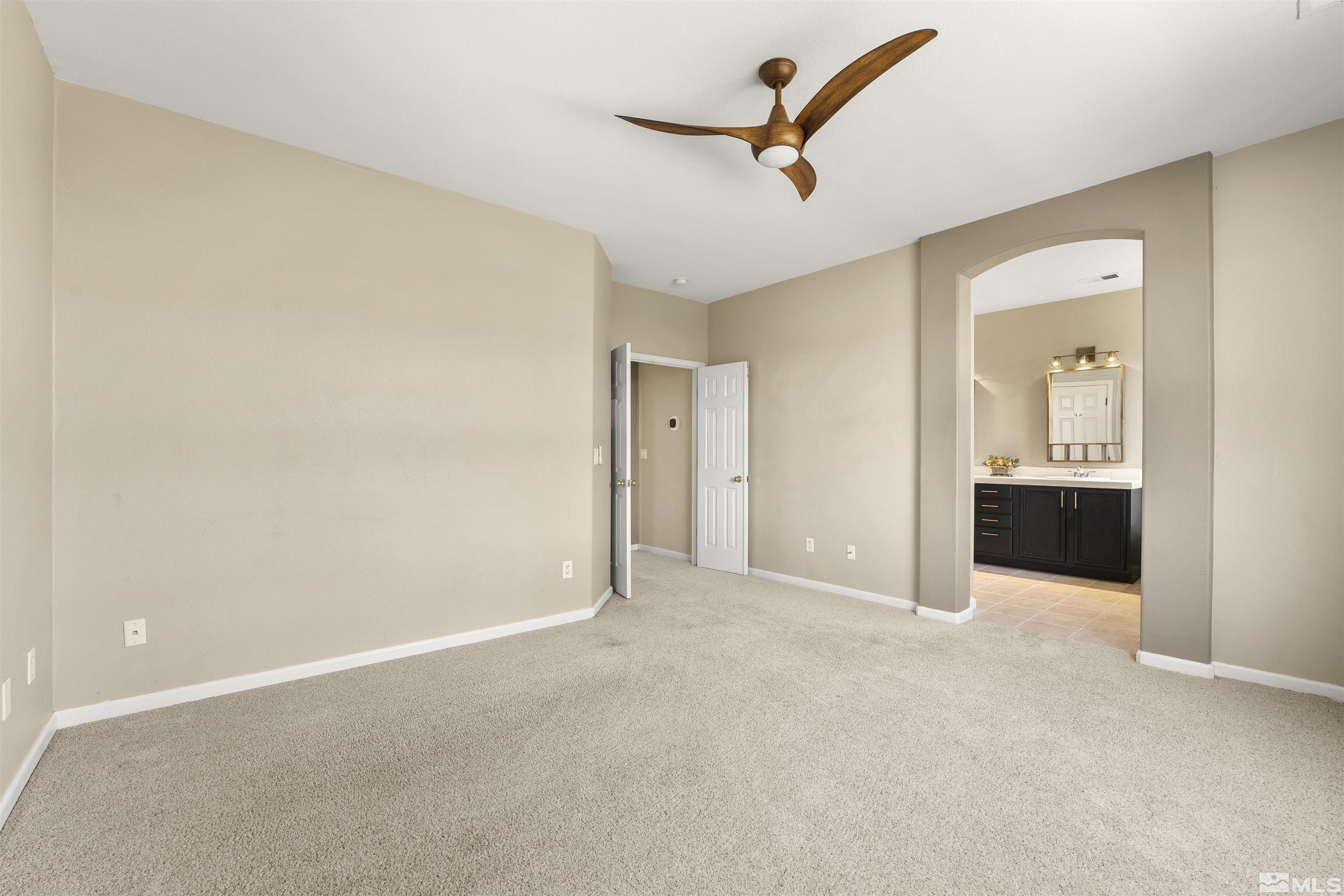 10200 Wolf Ridge Way Reno, NV 89521 - Photo 21 of 40 an empty room with a bathroom