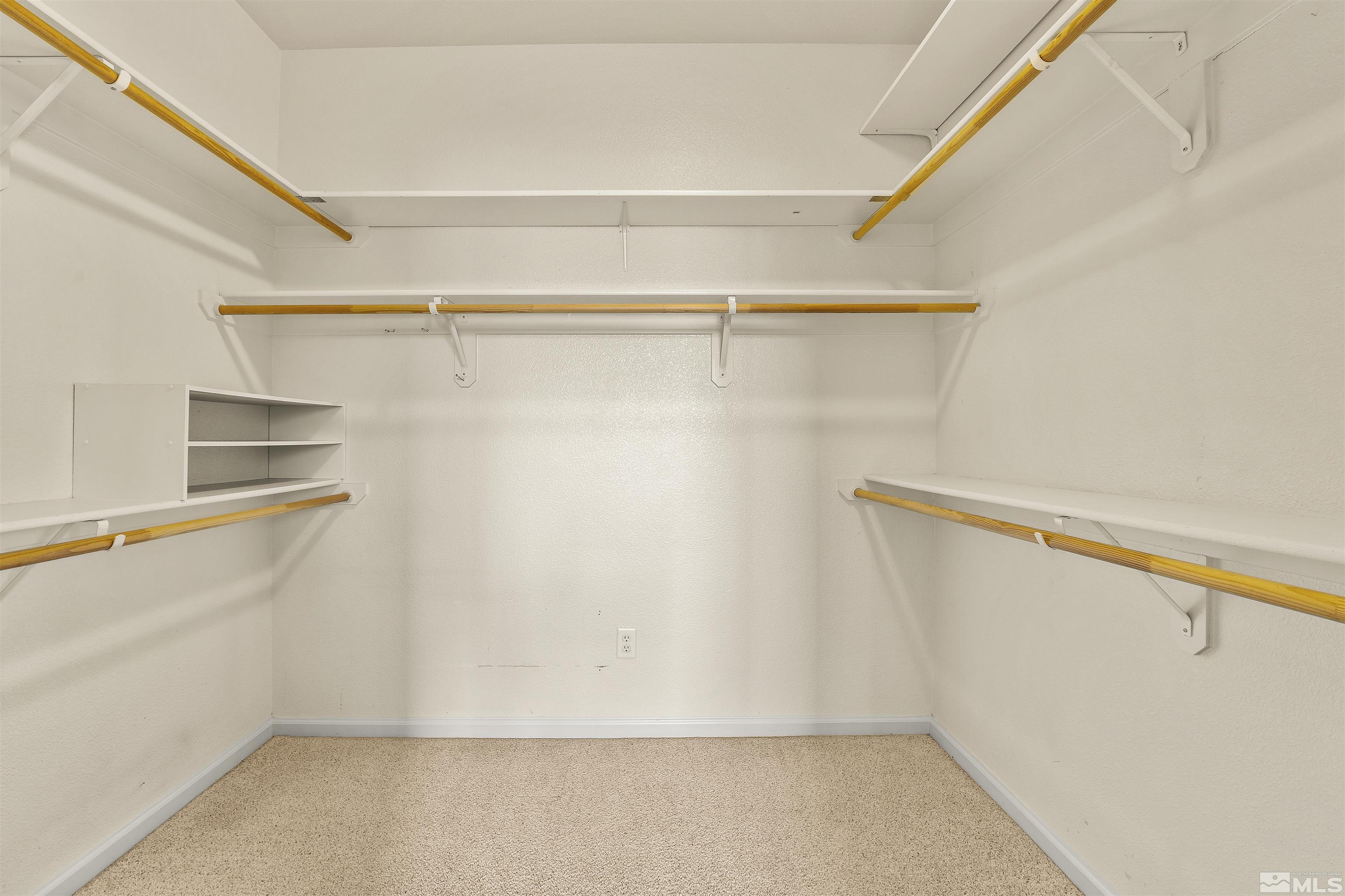 10200 Wolf Ridge Way Reno, NV 89521 - Photo 23 of 40 a view of walk in closet with empty racks