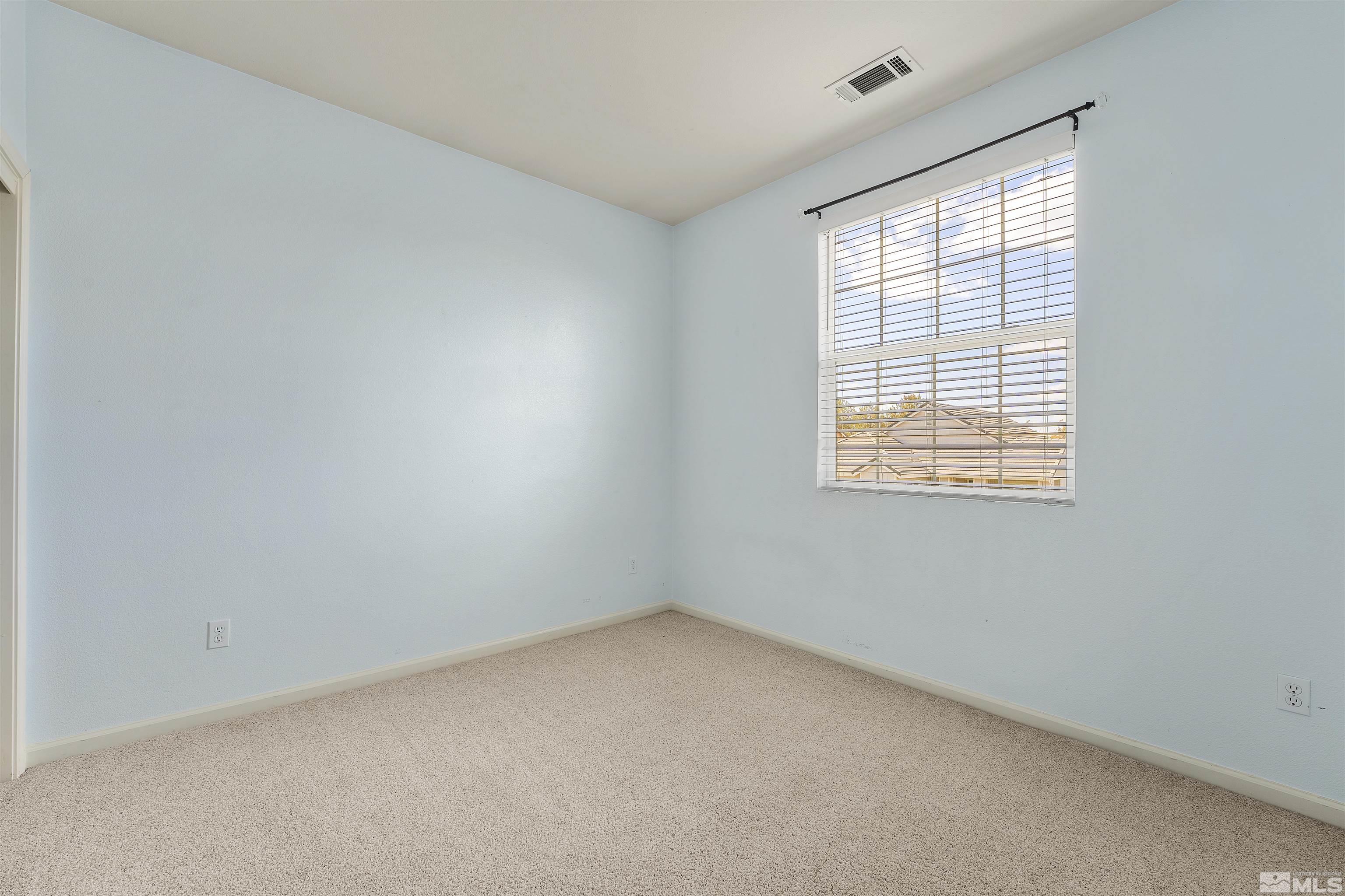 10200 Wolf Ridge Way Reno, NV 89521 - Photo 24 of 40 an empty room with a window