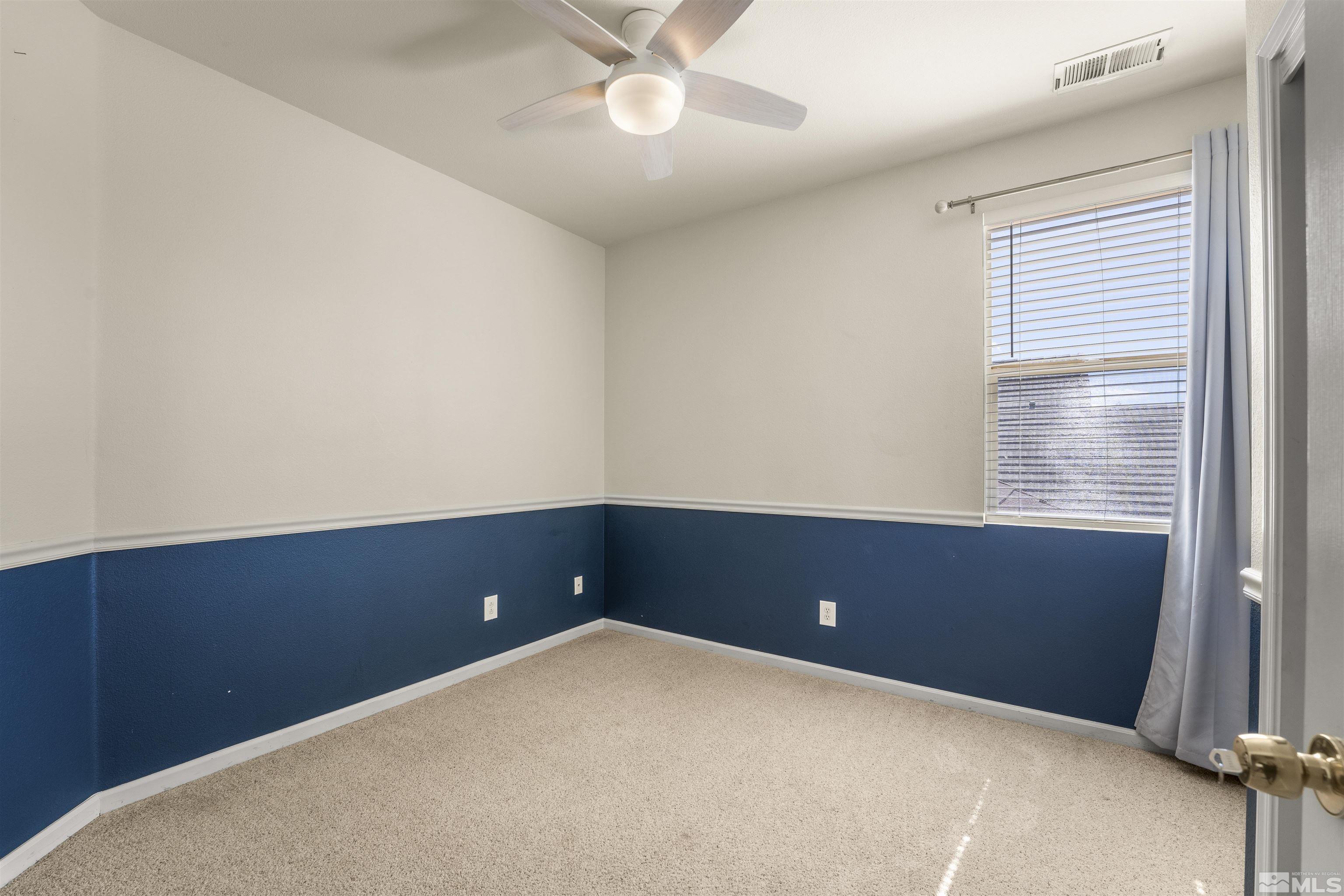 10200 Wolf Ridge Way Reno, NV 89521 - Photo 26 of 40 an empty room with a window