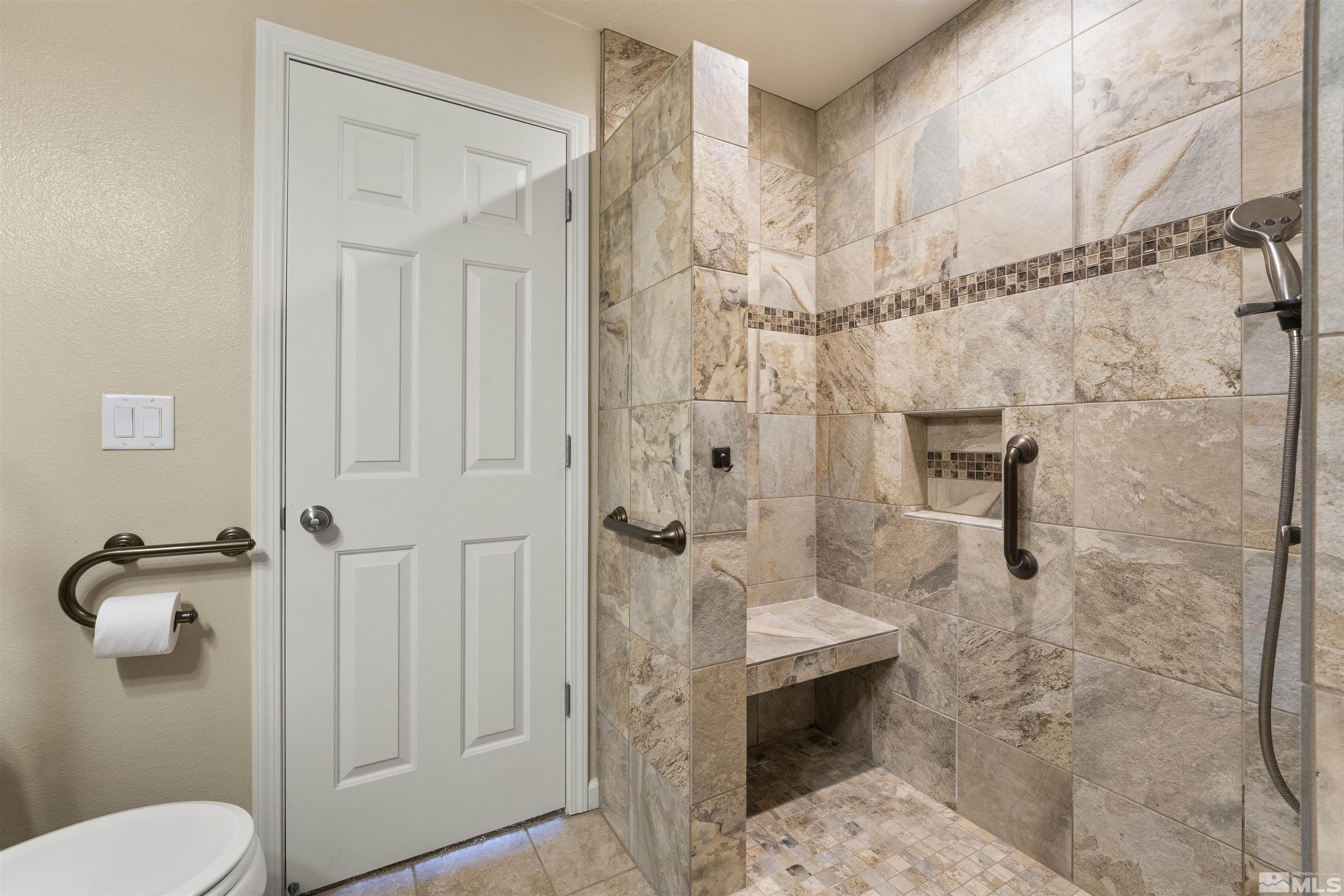 10200 Wolf Ridge Way Reno, NV 89521 - Photo 29 of 40 a bathroom with a shower