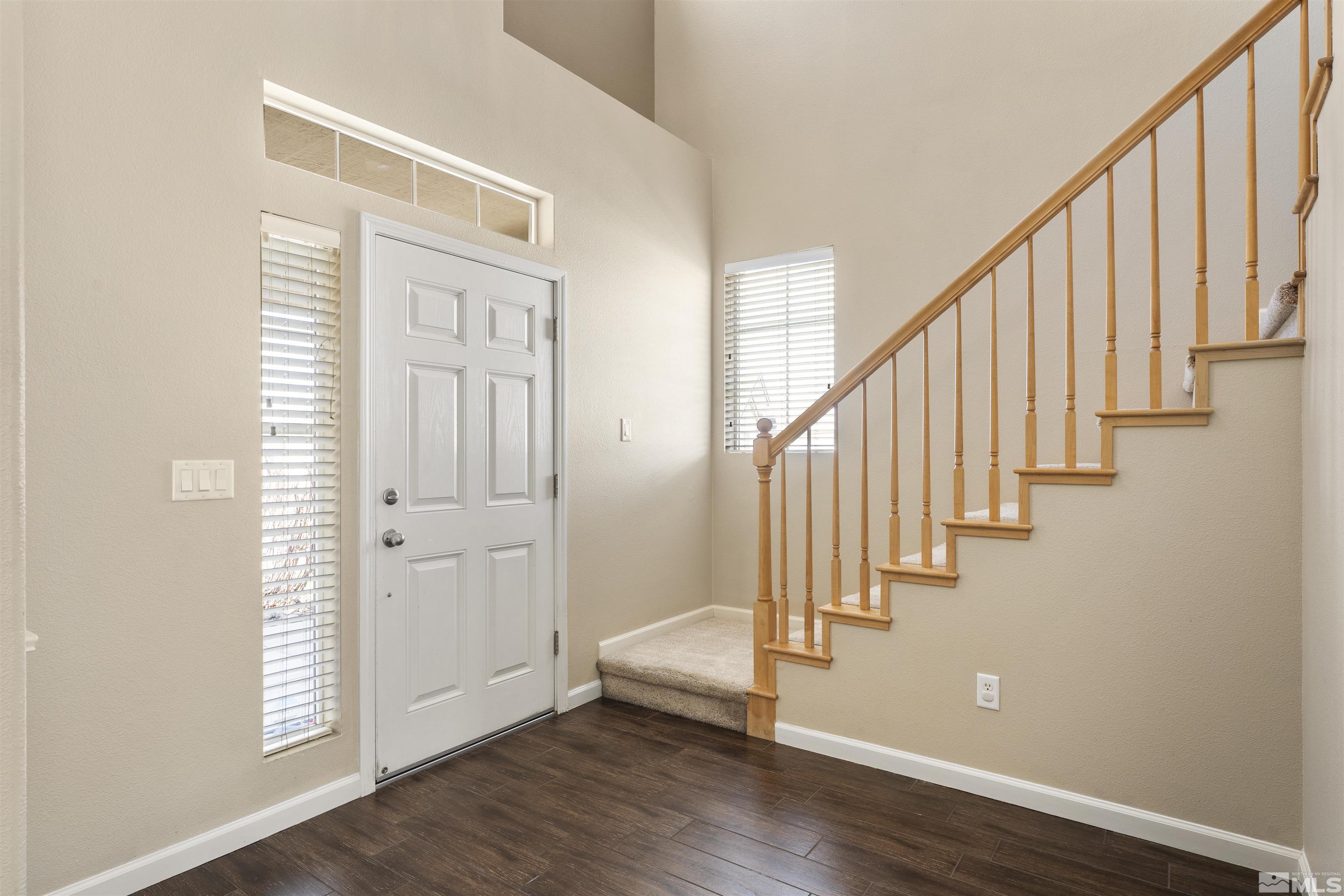 10200 Wolf Ridge Way Reno, NV 89521 - Photo 3 of 40 a view of an entryway with wooden floor