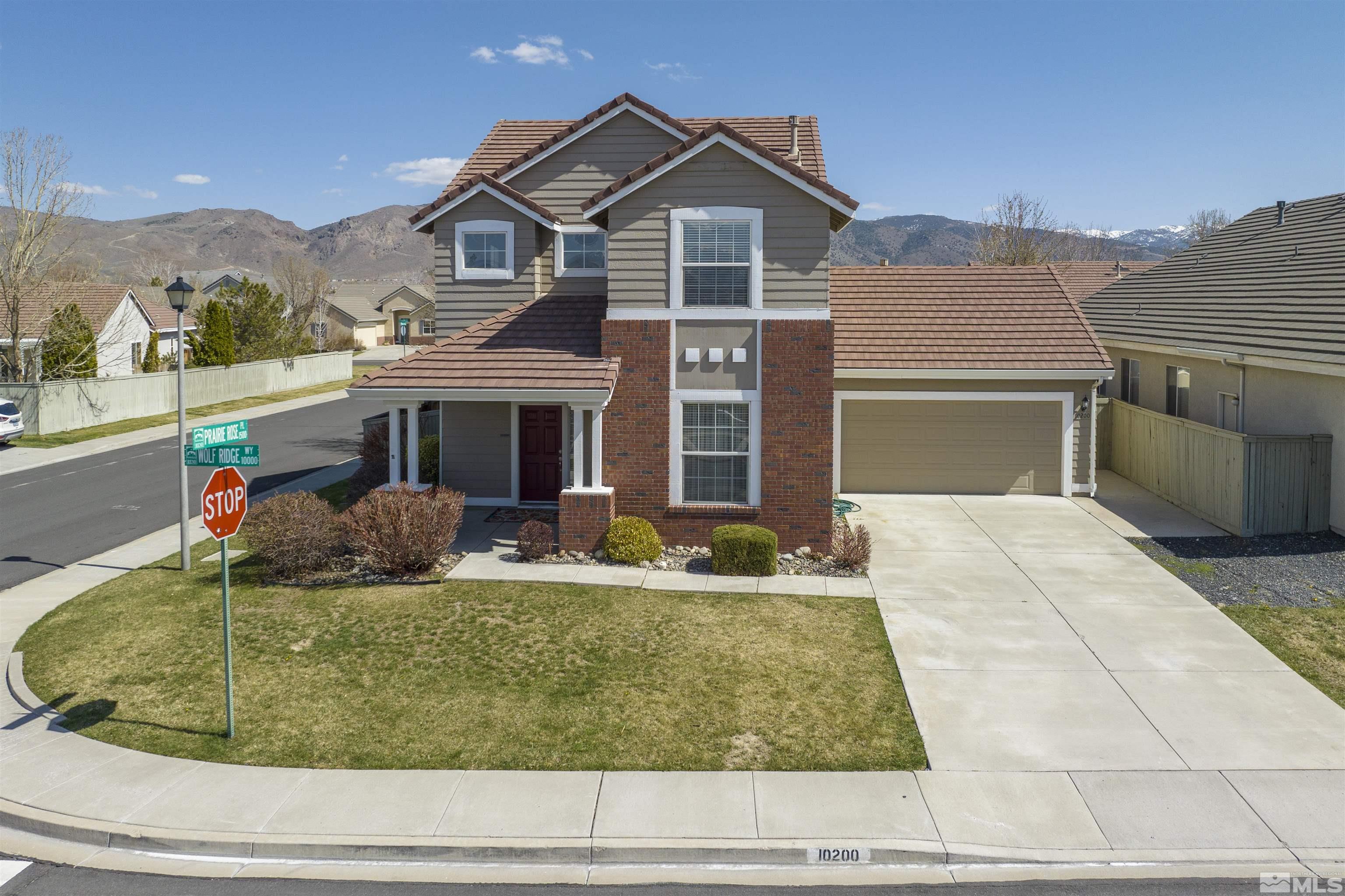 10200 Wolf Ridge Way Reno, NV 89521 - Photo 36 of 40 a front view of house with yard