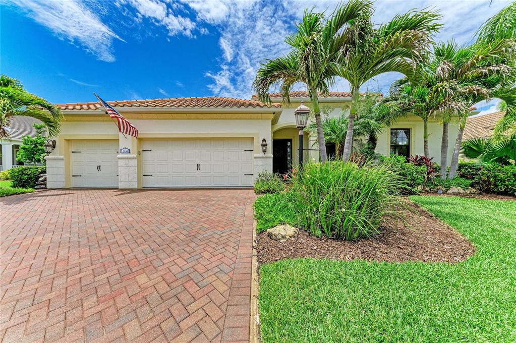 12642 Harney Street Venice, FL 34293 - Photo 1 of 85 a front view of a house with a garden