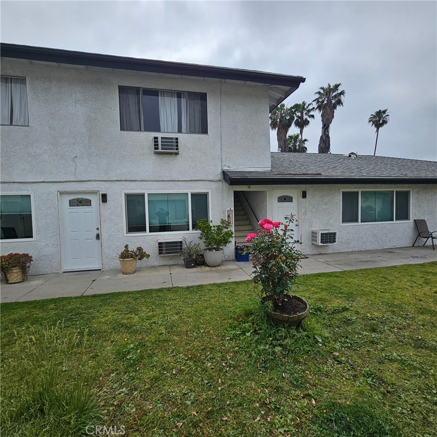 1051 Springfield Street, Unit C Upland, CA 91786 - Photo 1 of 14 a front view of a house with garden