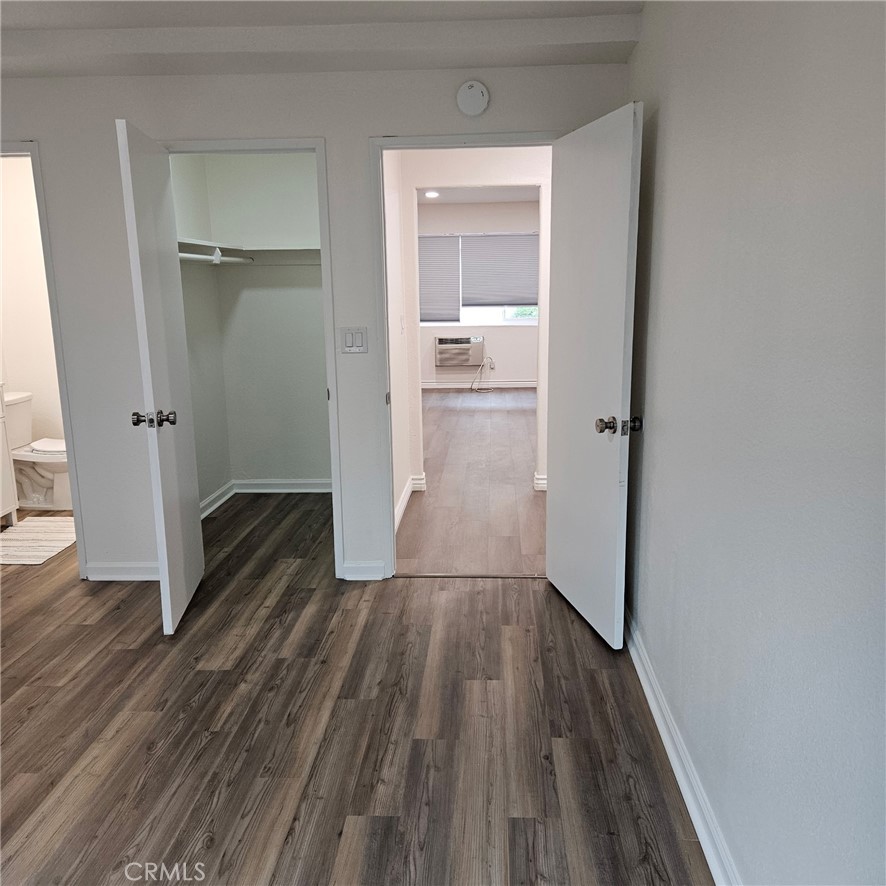 1051 Springfield Street, Unit C Upland, CA 91786 - Photo 14 of 14 a view of a hallway with wooden floor