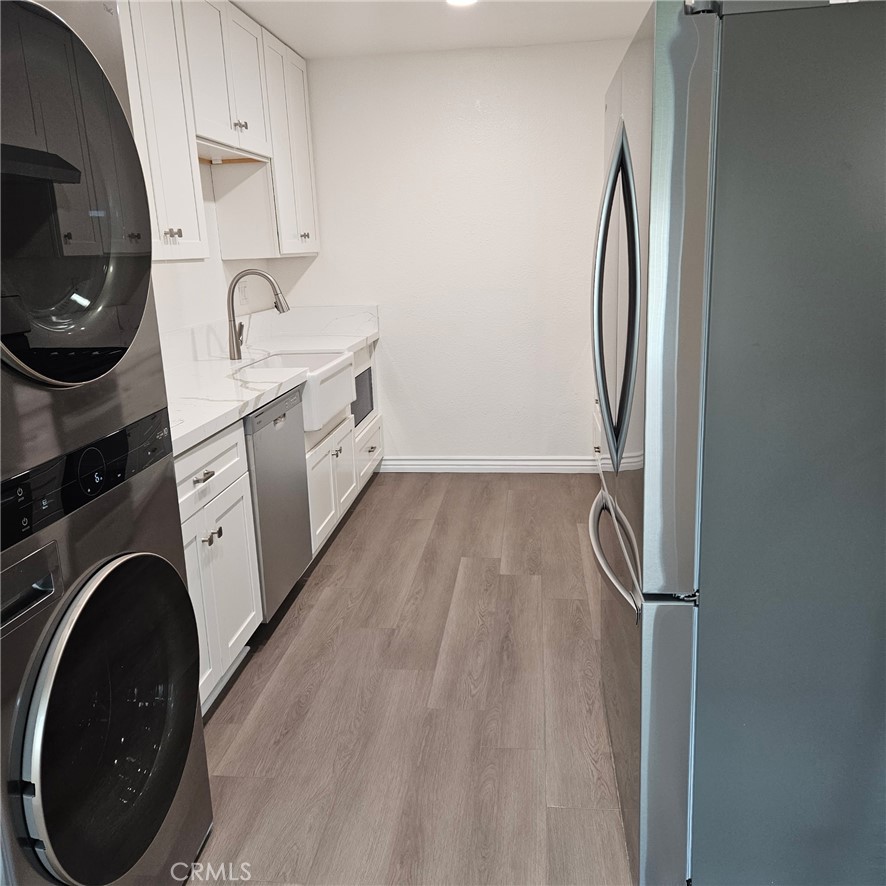 1051 Springfield Street, Unit C Upland, CA 91786 - Photo 6 of 14 a view of a kitchen with sink washer and dryer