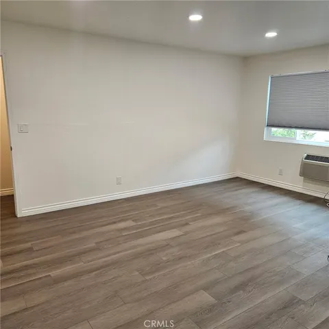 a view of a livingroom with wooden floor