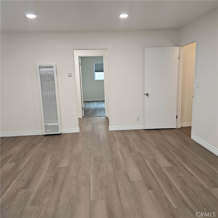 1051 Springfield Street, Unit C Upland, CA 91786 - Photo 9 of 14 a view of a livingroom with wooden floor