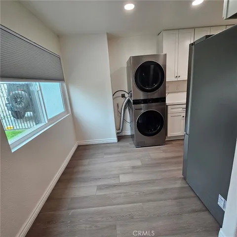 a view of a refrigerator in kitchen and dishwasher