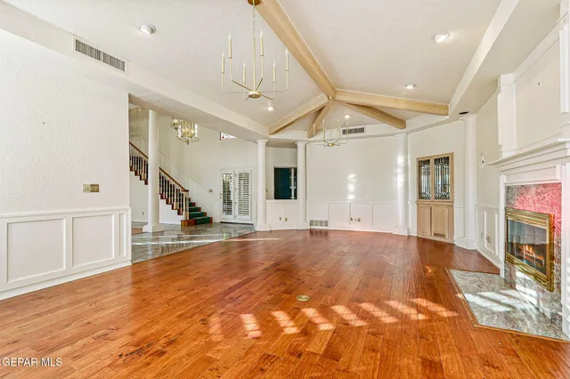 a view of entryway with wooden floor and stairs